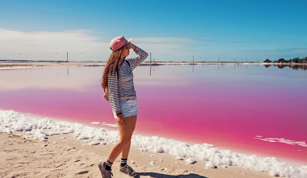 Woman near the pink lake ( Las Coloradas )